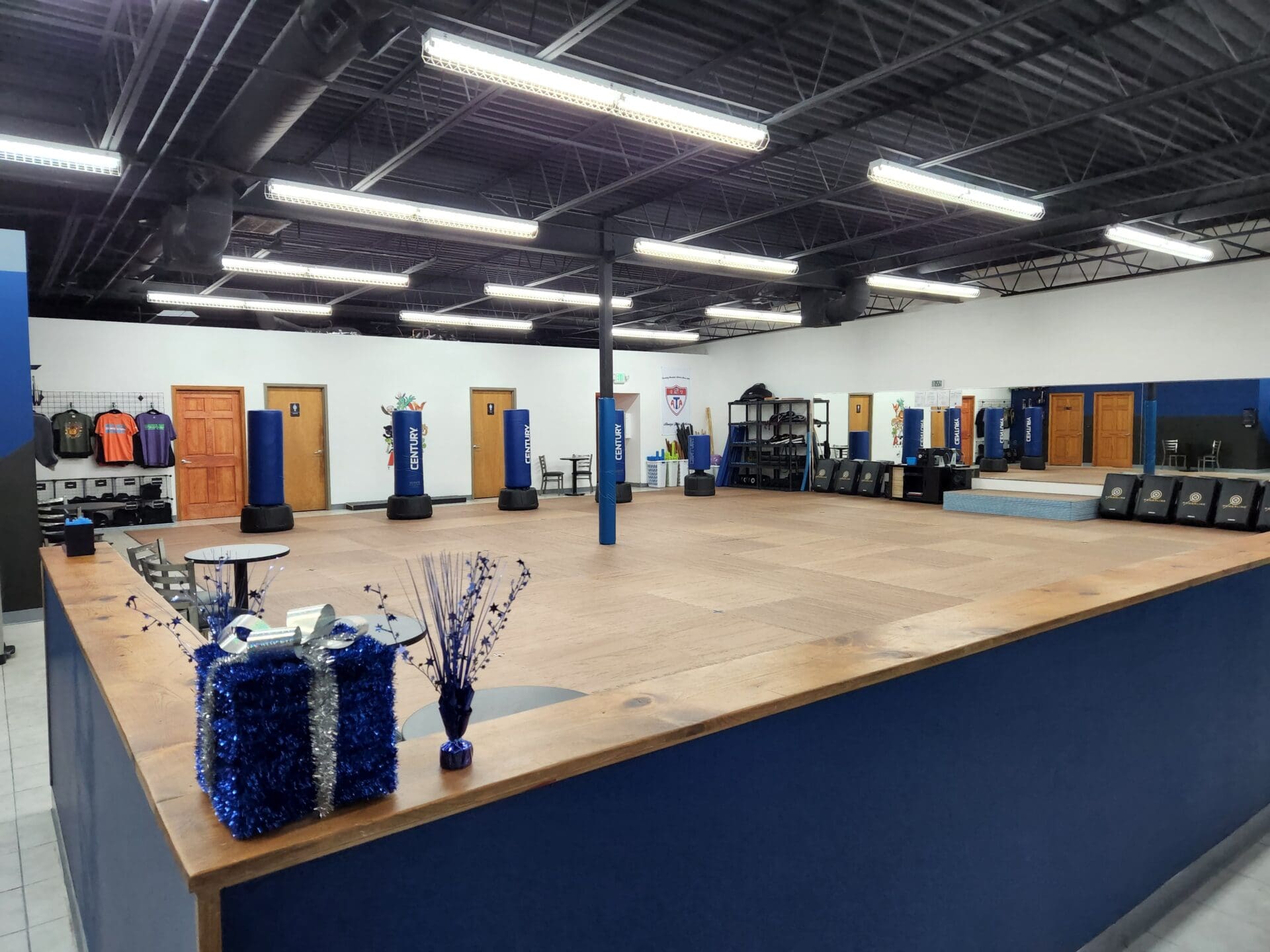 A room with many blue and white vases on the floor.